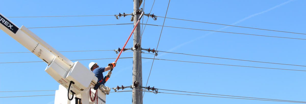 man fixing power transmission lines